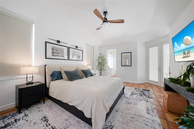 bedroom with french doors, light tile patterned floors, and ceiling fan