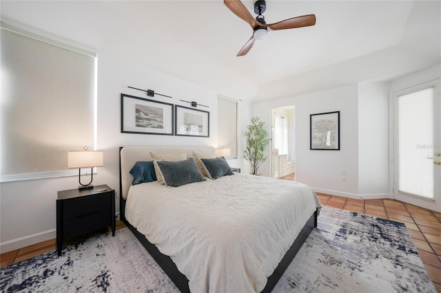 tiled bedroom with ceiling fan and ensuite bathroom