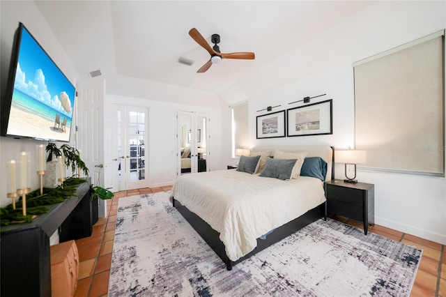 bedroom featuring ceiling fan, french doors, and light tile patterned floors