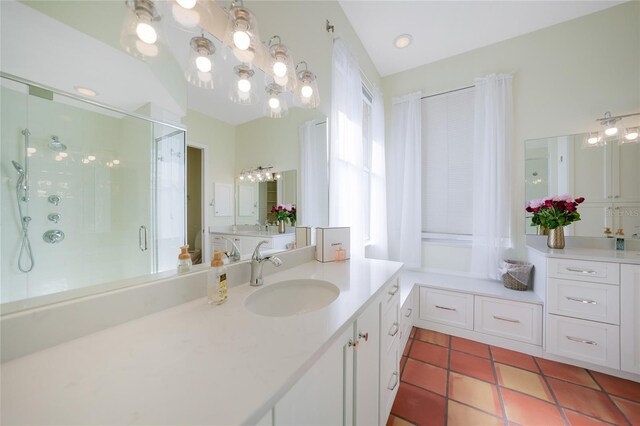 bathroom featuring tile patterned flooring, vanity, and a shower with door