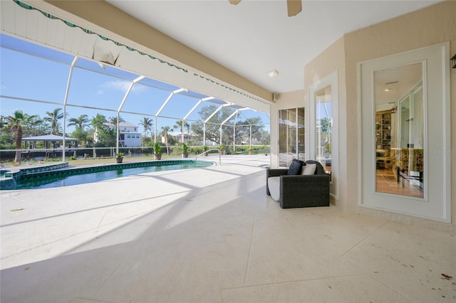 view of pool with a lanai and a patio