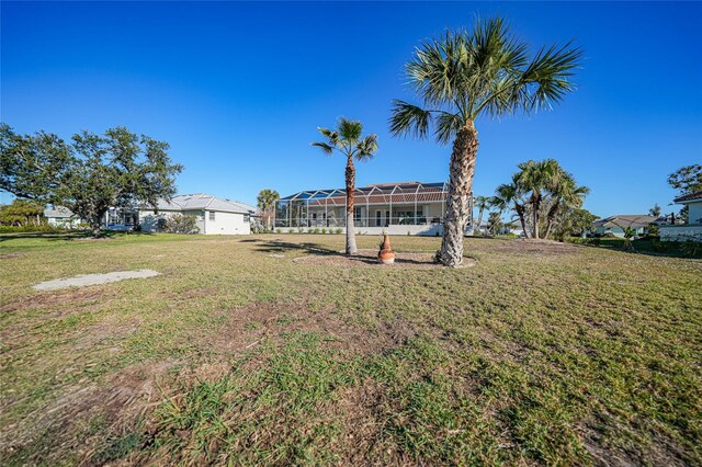 view of yard featuring a lanai