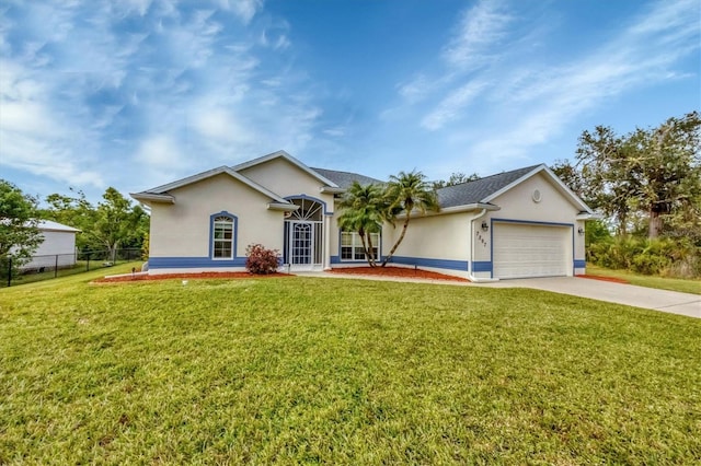 ranch-style house featuring a front lawn and a garage