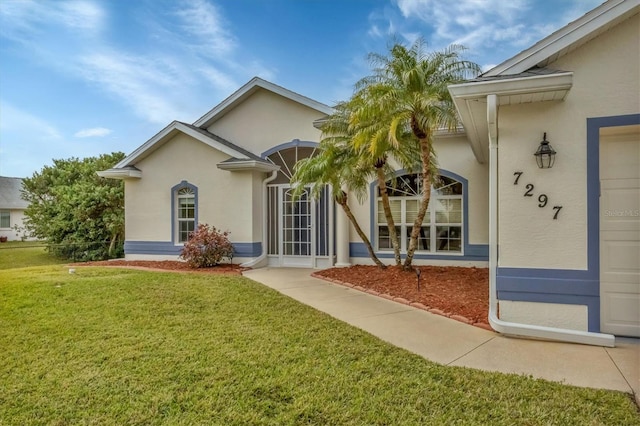 property entrance with a yard