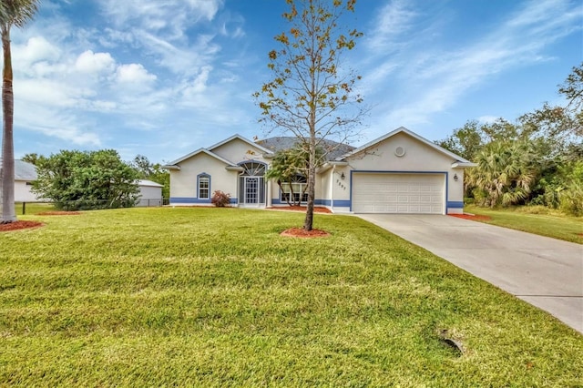 ranch-style house featuring a front yard and a garage