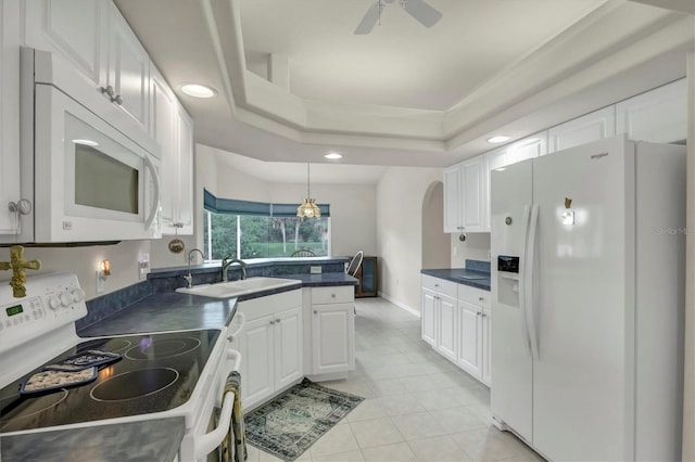 kitchen featuring white cabinetry, sink, pendant lighting, white appliances, and light tile patterned floors