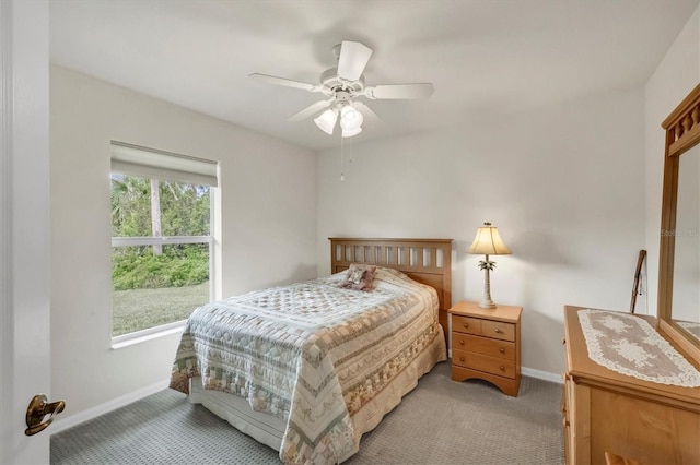 bedroom featuring light carpet and ceiling fan