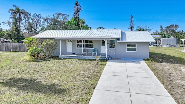 single story home with a front yard and a porch