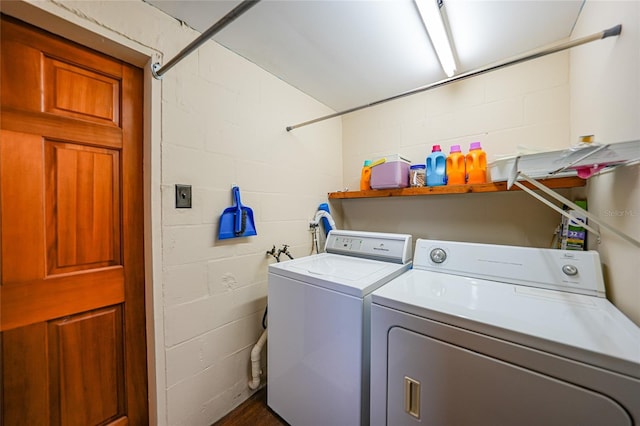 laundry room with washing machine and clothes dryer