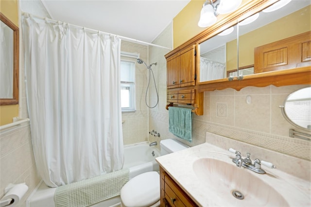 full bathroom featuring vanity, toilet, and shower / tub combo with curtain