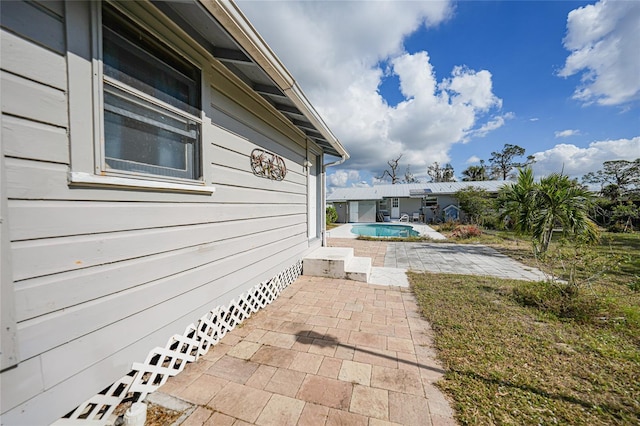 view of side of home featuring a patio