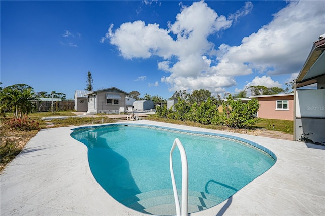 view of swimming pool featuring a patio