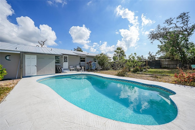 view of swimming pool with a patio