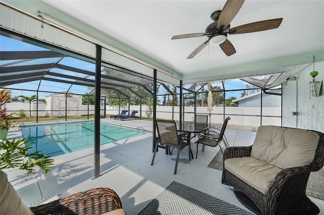 view of pool featuring a patio, a lanai, and a storage shed