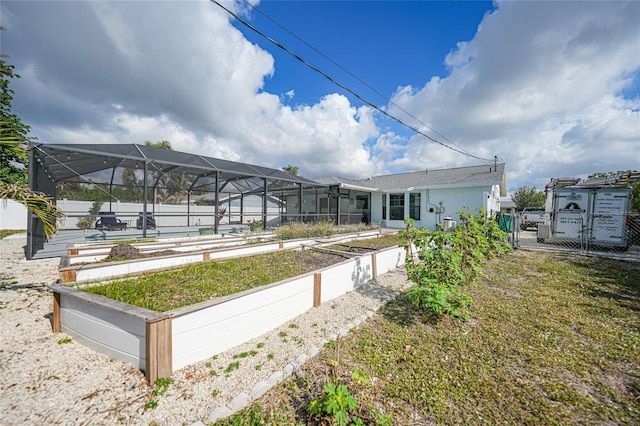 exterior space with a lanai and a pool