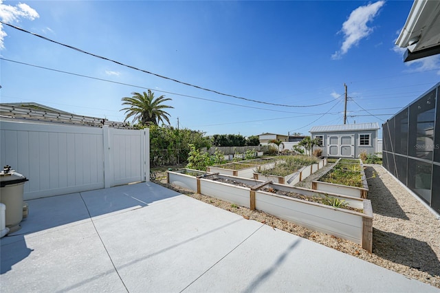 view of patio with a storage unit