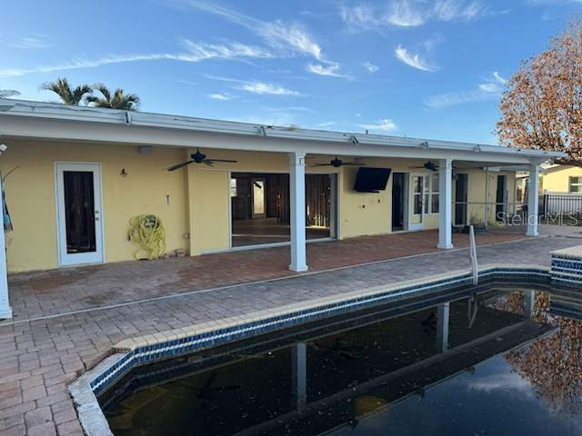 rear view of house featuring a patio area and ceiling fan