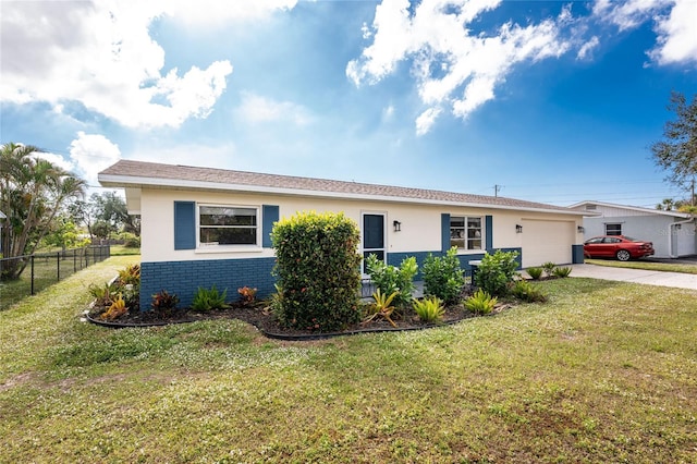 single story home with a garage and a front lawn