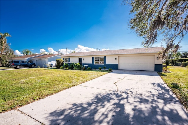 single story home with a front lawn and a garage