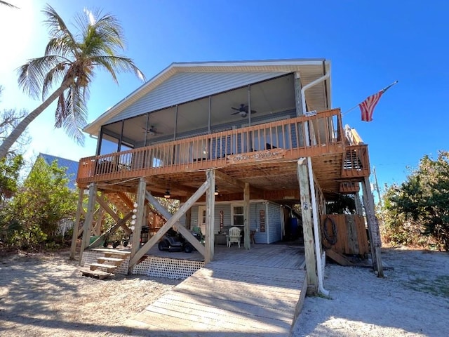 exterior space featuring a ceiling fan, stairway, and a wooden deck