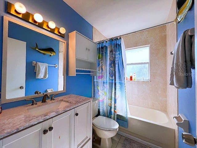 bathroom with tile patterned flooring, vanity, toilet, and shower / bath combo with shower curtain