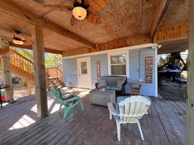 9526 Jolly Roger Trl, Placida, FL 33946 - deck featuring stairway, a ceiling fan, and an outdoor living space