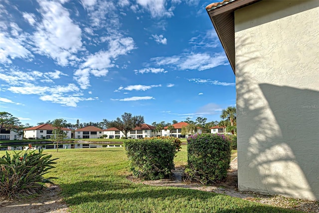 524 Pine Hollow Cir Unit 524, Englewood, FL 34223 - view of green lawn featuring a residential view