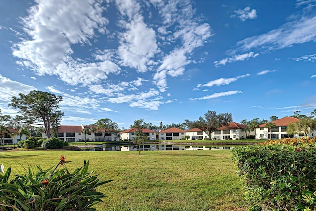 524 Pine Hollow Cir Unit 524, Englewood, FL 34223 - view of community with a residential view, a yard, and a water view
