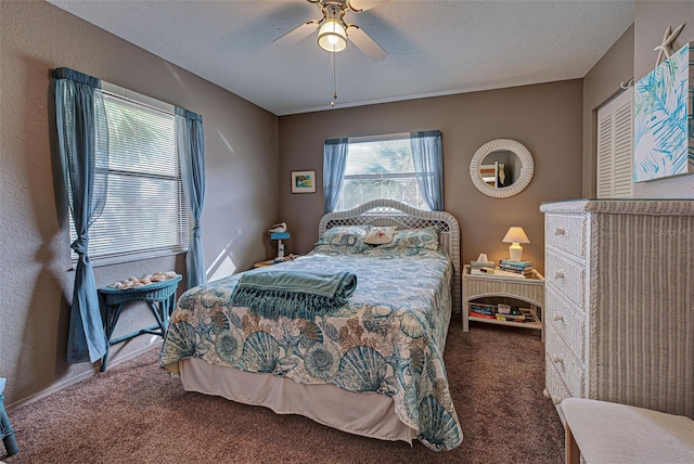 524 Pine Hollow Cir Unit 524, Englewood, FL 34223 - carpeted bedroom featuring multiple windows and ceiling fan