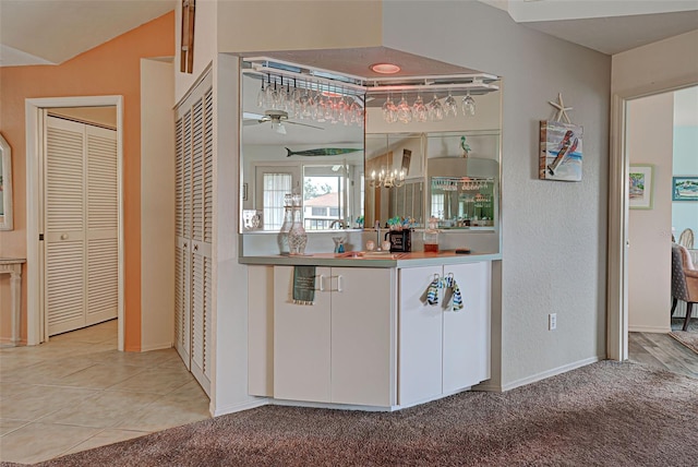 524 Pine Hollow Cir Unit 524, Englewood, FL 34223 - bar featuring a ceiling fan and carpet