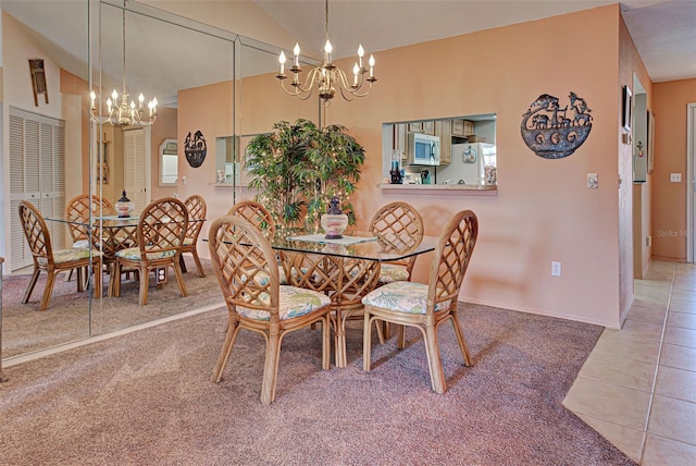 524 Pine Hollow Cir Unit 524, Englewood, FL 34223 - carpeted dining space with a chandelier and tile patterned floors