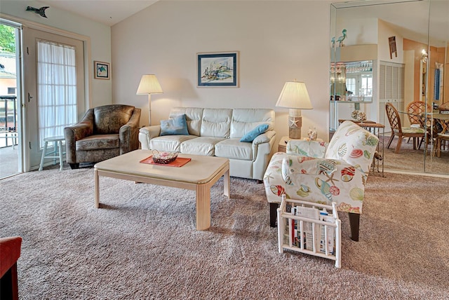 524 Pine Hollow Cir Unit 524, Englewood, FL 34223 - living room featuring carpet flooring and lofted ceiling