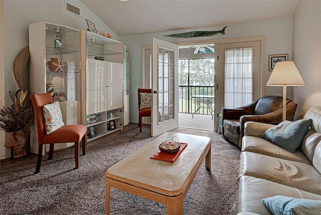 524 Pine Hollow Cir Unit 524, Englewood, FL 34223 - living room featuring carpet flooring, vaulted ceiling, and french doors