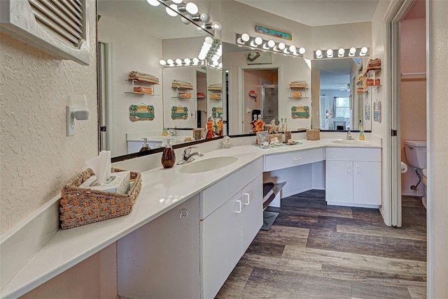 524 Pine Hollow Cir Unit 524, Englewood, FL 34223 - full bath featuring wood finished floors, double vanity, and a textured wall