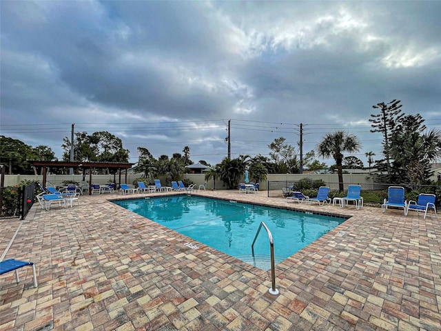 524 Pine Hollow Cir Unit 524, Englewood, FL 34223 - community pool with a patio area and a pergola