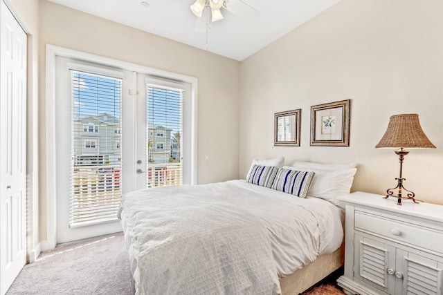 bedroom with access to outside, multiple windows, and carpet