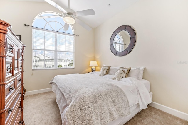 bedroom with ceiling fan, light carpet, and lofted ceiling