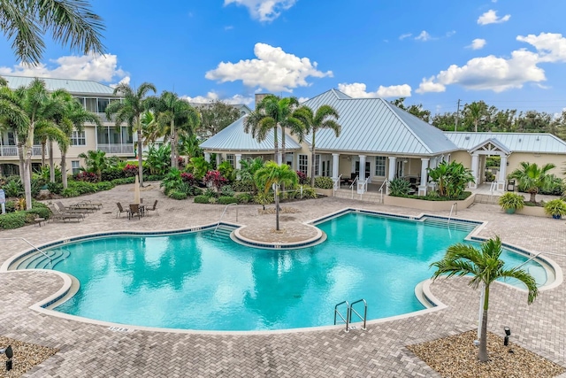 view of swimming pool featuring a patio area