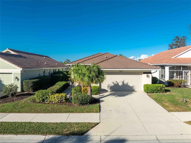 view of front of property with a garage