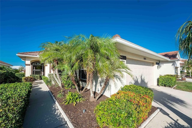 view of side of home with a garage