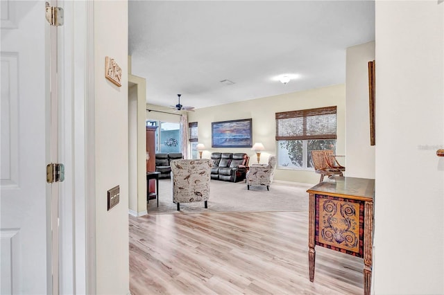 hall with light hardwood / wood-style flooring