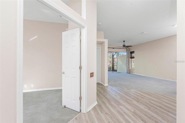 hallway with light wood-type flooring