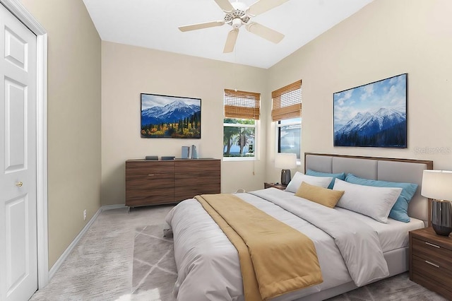 bedroom with ceiling fan and light colored carpet