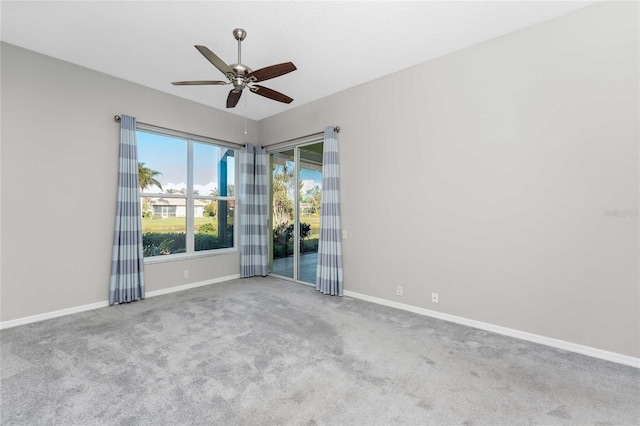 empty room with light carpet and ceiling fan