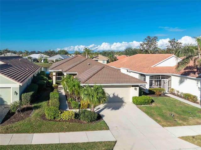 view of front of home featuring a front lawn and a garage