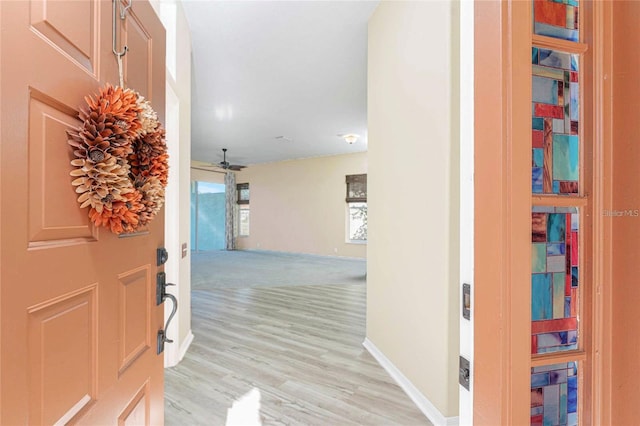 entryway featuring light wood-type flooring and ceiling fan