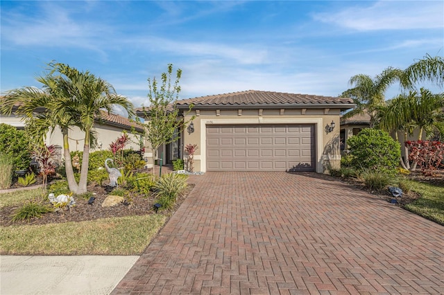 mediterranean / spanish-style house with a garage