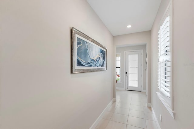 entryway with light tile patterned floors