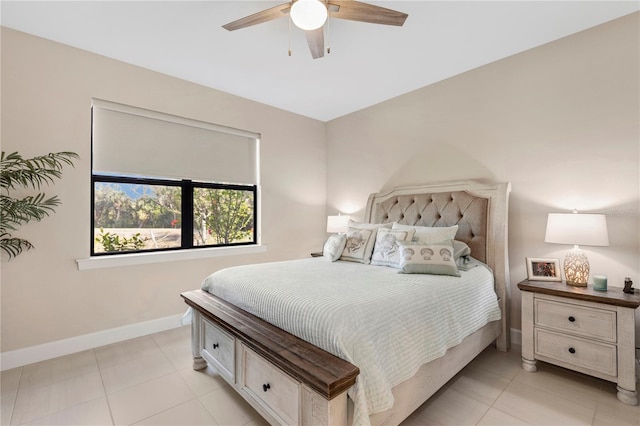 tiled bedroom with ceiling fan