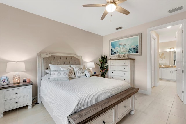 bedroom with ensuite bathroom, ceiling fan, and light tile patterned floors